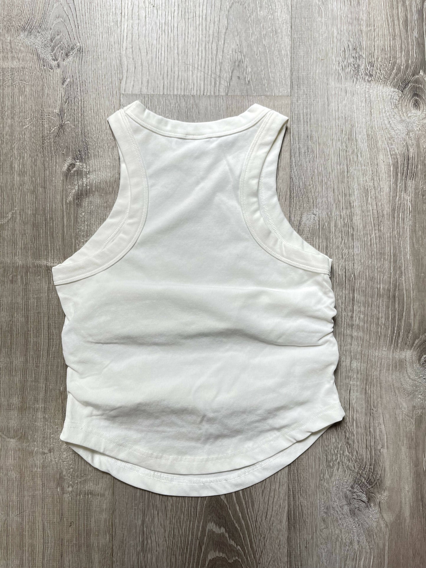 Folded Elegance: The Innovative Silhouette Sleeveless Cotton T-Shirt
