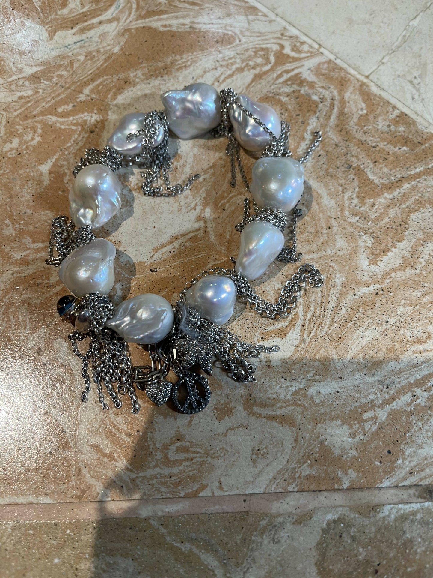 Fringe pearl bracelet with charms