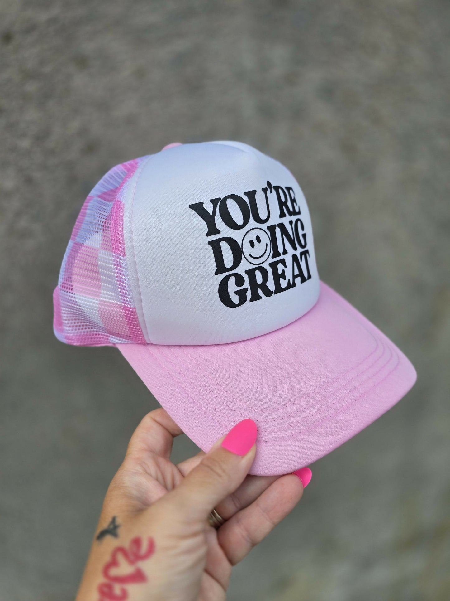 Doing Great Pink Checkered Trucker Hat