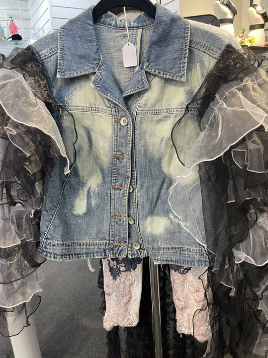 Denim jacket with added sleeve