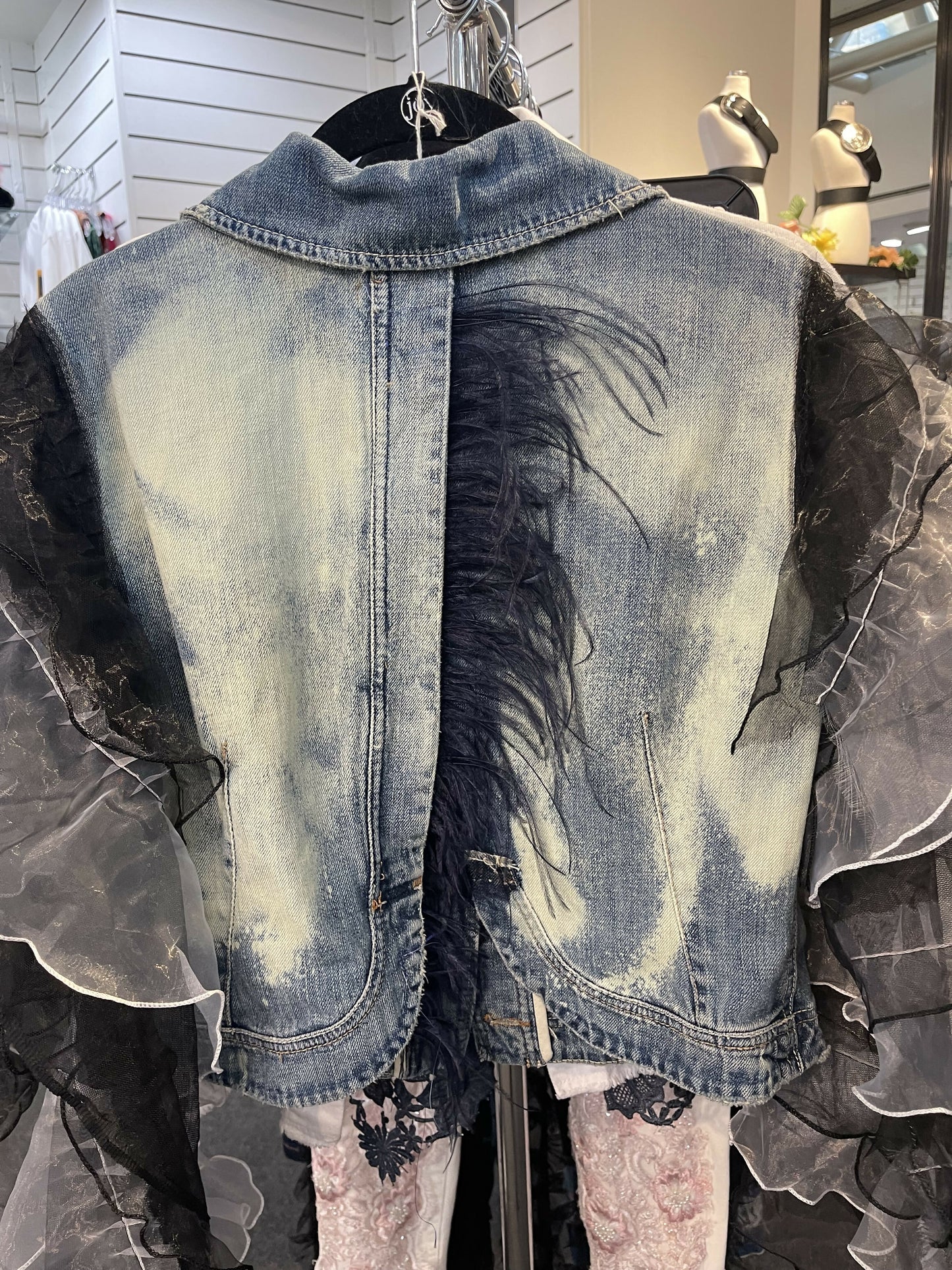 Denim jacket with added sleeve