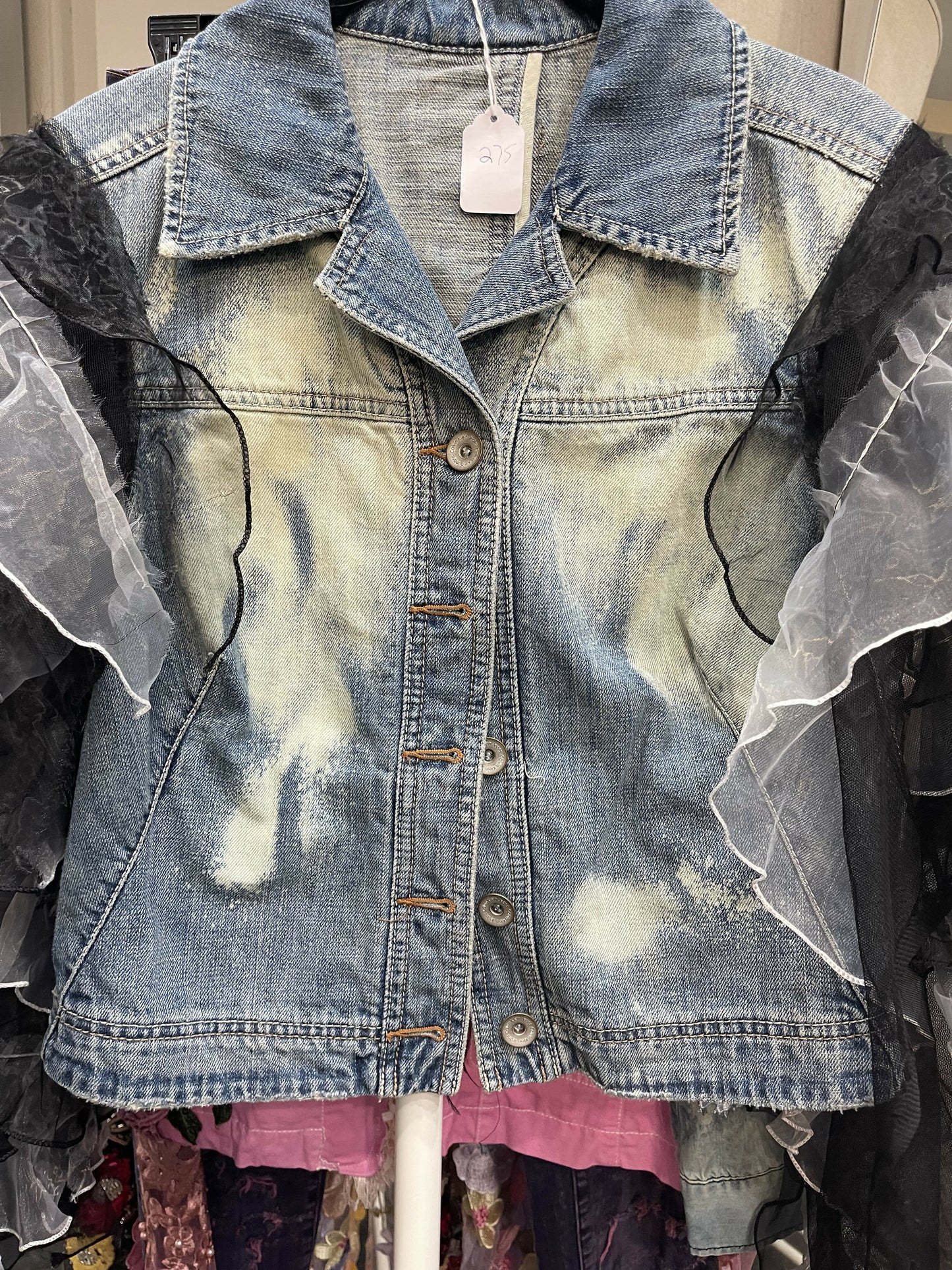 Denim jacket with added sleeve