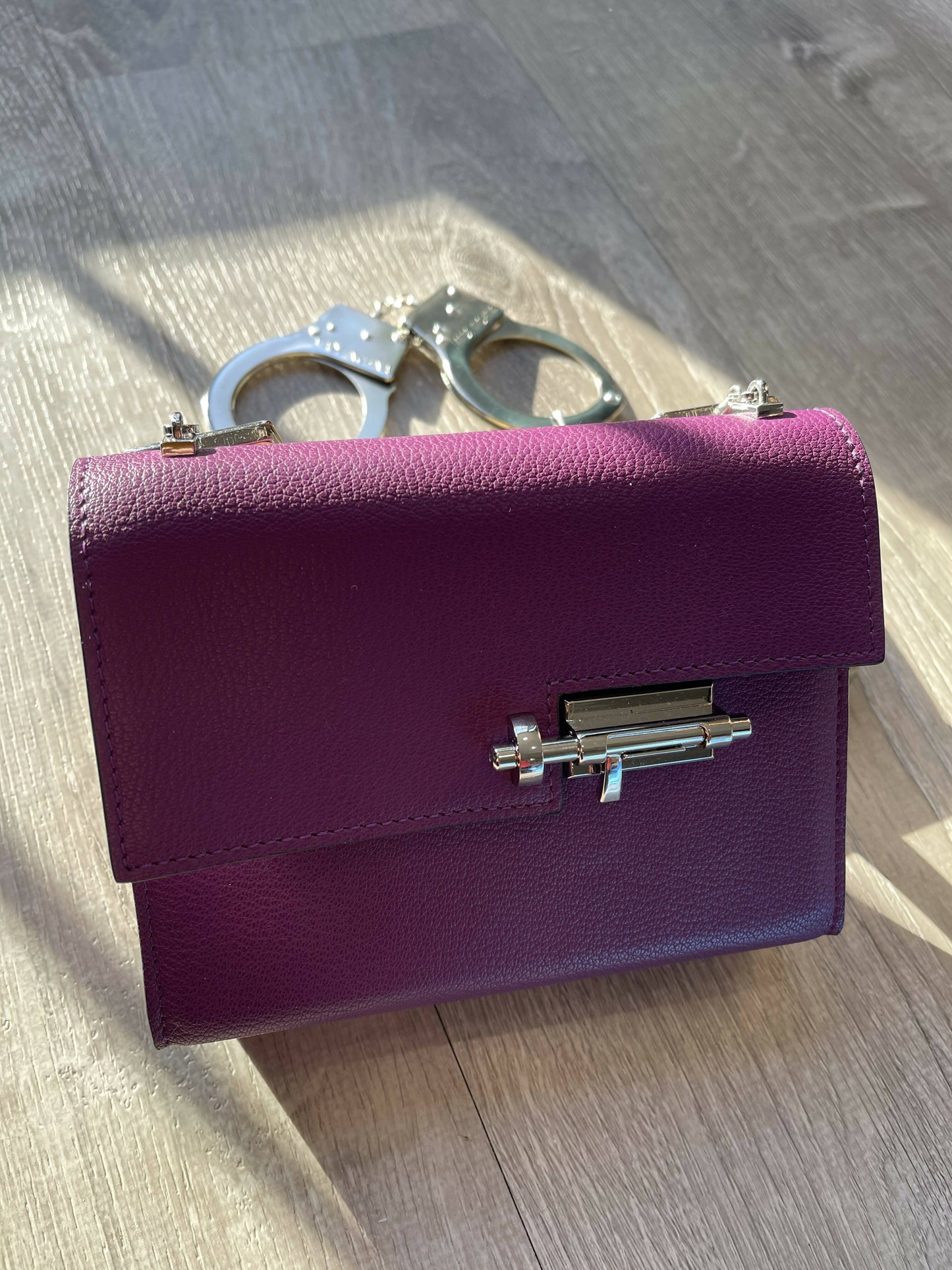 Purple Allure: Vintage-Inspired Leather Bag with Bold Handcuff Handle